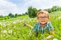 Little boy smiles laying on a grass Royalty Free Stock Photo