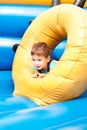 A little boy smiling and playing