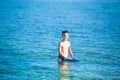 Little boy with snorkel by the sea. Cute little kid wearing mask and flippers for diving at sand tropical beach. Ocean coast Royalty Free Stock Photo