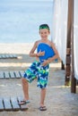 Little boy with snorkel by the sea. Cute little kid wearing mask and flippers for diving at sand tropical beach. Ocean coast Royalty Free Stock Photo