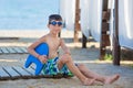 Little boy with snorkel by the sea. Cute little kid wearing mask and flippers for diving at sand tropical beach. Ocean coast Royalty Free Stock Photo