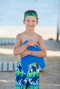 Little boy with snorkel by the sea. Cute little kid wearing mask and flippers for diving at sand tropical beach. Ocean coast Royalty Free Stock Photo