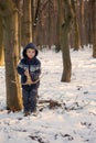 Little boy in the snow with crossbow Royalty Free Stock Photo