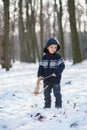 Little boy in the snow with crossbow Royalty Free Stock Photo