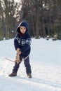 Little boy in the snow with crossbow Royalty Free Stock Photo