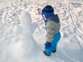 Little boy and snowman