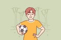 Little boy with soccer ball enjoys outdoor recreation and with smile looks at screen Royalty Free Stock Photo