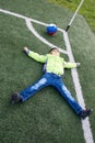 Little boy soccer ball lying on grass Royalty Free Stock Photo