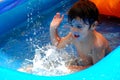 Little boy splashing in a pool Royalty Free Stock Photo