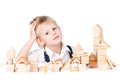 Little boy stacks house from wooden blocks isolate Royalty Free Stock Photo