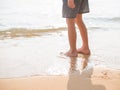 Little boy standing on the beach sand Royalty Free Stock Photo