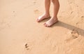 Little boy standing on the beach sand Royalty Free Stock Photo