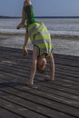 Little boy standing on his arms