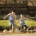 Little boy standing in puddle Royalty Free Stock Photo