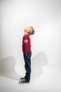 Little Boy Standing Sideways and Looking Up Royalty Free Stock Photo