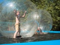 Little boy stands inside the water bowl and smiling Royalty Free Stock Photo