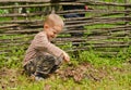 Little boy starting a fire outdoors Royalty Free Stock Photo