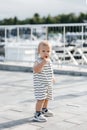 A little boy in a striped T-shirt with big blue eyes Royalty Free Stock Photo