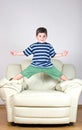 little boy in a striped T-shirt and green shorts Royalty Free Stock Photo