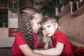 Boy stroking her sisters hair to calm down, negative emotions, special behavior in childhood Royalty Free Stock Photo