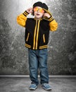 The little boy in the style of Hip-Hop . Children`s fashion.Cap and jacket. The Young Rapper.Cool dj. Royalty Free Stock Photo