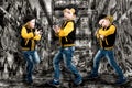 The little boy in the style of Hip-Hop . Children`s fashion.Cap and jacket. The Young Rapper.Graffiti on the walls.Cool rap dj. Royalty Free Stock Photo