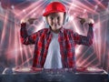 The little boy in the style of Hip-Hop .Cool rap dj. Children`s fashion.Cap and jacket. The Young Rapper. Royalty Free Stock Photo