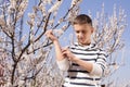 Little boy suffering from seasonal allergy outdoors