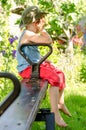 Little boy sulking as he sits on a seesaw Royalty Free Stock Photo