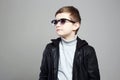 Little boy in sunglasses. stylish kid in leather Royalty Free Stock Photo