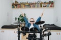 Little boy superstar in sunglasses playing electronic drums at home