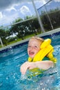 Little boy swimming with life vest on Royalty Free Stock Photo