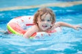 Little boy in the swimming pool with rubber ring Royalty Free Stock Photo