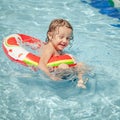 Little boy in the swimming pool with rubber ring Royalty Free Stock Photo