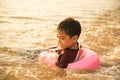 Little boy swimming on the sea beach Royalty Free Stock Photo