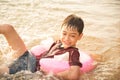 Little boy swimming on the sea beach Royalty Free Stock Photo