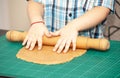 Boy swinging a rolling pin cookie dough Royalty Free Stock Photo