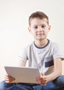 Little boy with tablet computer. Childhood, education, learning, technology, leisure concept