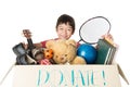 Little boy taking Donation box full with stuff for donate Royalty Free Stock Photo