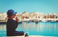 Little boy taking photos on the quay of Malta, Europe Royalty Free Stock Photo