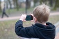 Little boy taking photos Royalty Free Stock Photo