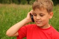 Little boy talking on cell phone outdoors Royalty Free Stock Photo