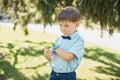 Little boy talking on smart watch with mother Royalty Free Stock Photo