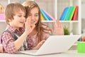 Portrait of a boy and girl using laptop Royalty Free Stock Photo