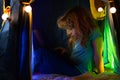 Little boy in tent bed looking at the laptop at night. Child boy using computer at night in bed. Social network for kids Royalty Free Stock Photo