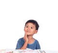 Little boy thinking while doing homework Royalty Free Stock Photo