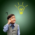 Little boy thinking get idea green Royalty Free Stock Photo