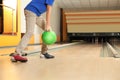 Little boy throwing ball in bowling club. Space for text Royalty Free Stock Photo