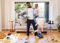 This day has been too long. a little boy throwing a tantrum while holding his parents leg at home. Royalty Free Stock Photo