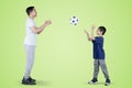 Little boy throws a soccer ball to his father Royalty Free Stock Photo